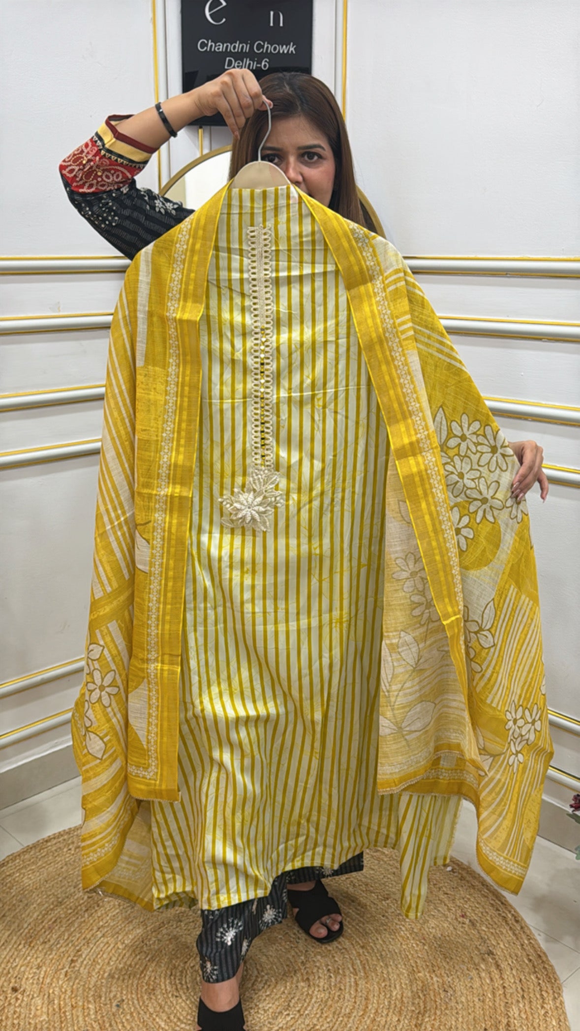 Model showcasing a yellow premium cotton shirt with pearl details and floral embroidery